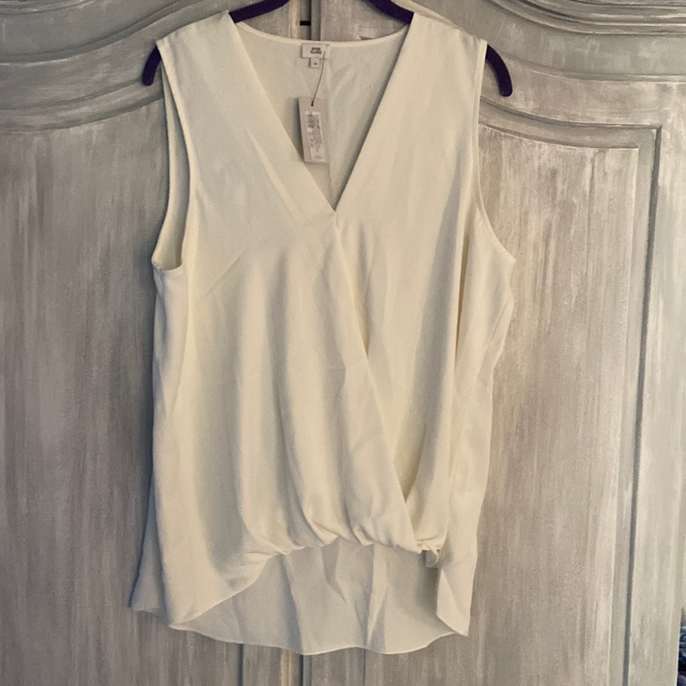 River Island Cream colored sleeveless blouse